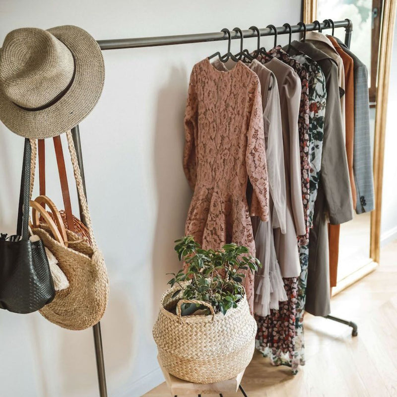 free standing clothes rack made from dark water pipes for open wardrobe in bedroom